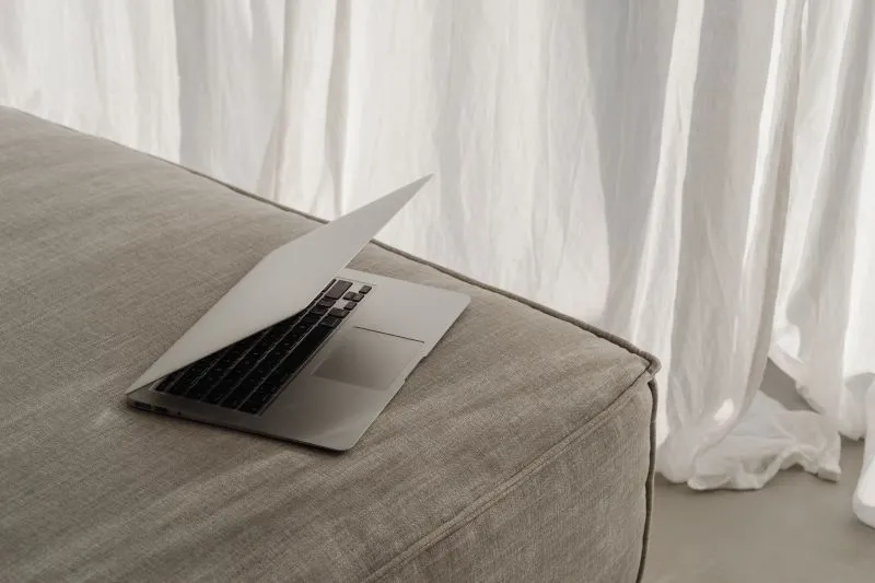 Sliver clean laptop on a bed